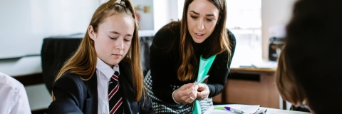 Student with teacher in class